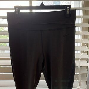 Nike leggings. Black and green striped. Size M.